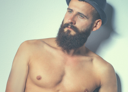 Portrait of handsome bearded man standing  isolated on greyの写真素材