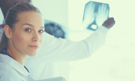 Doctors analyzing an x-ray in a metingの写真素材