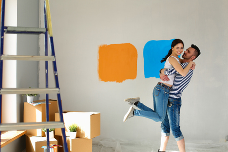 Portrait of a cute young couple into their new homeの写真素材