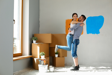 Portrait of a cute young couple into their new homeの写真素材