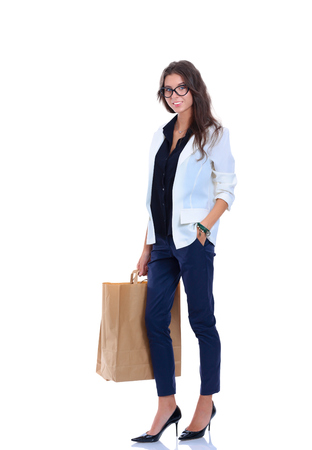 beautiful woman with shoping bags. Isolated over white background .の写真素材