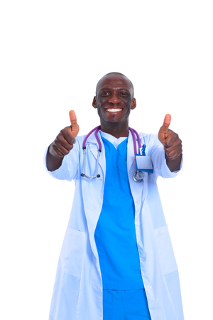 Portrait of doctor showing you ok sign standing in a white uniform on isolated backgroundの写真素材
