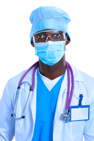 Portrait of a doctor wearing a mask and uniform. isolated on white backgroundの写真素材