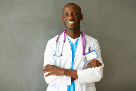 Doctor with arms folded in modern officeの写真素材