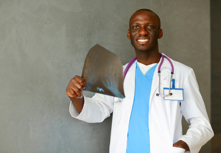 picture of male doctor looking at x-rayの写真素材
