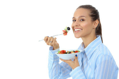 A beautiful girl eating healthy foodの写真素材