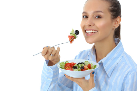 A beautiful girl eating healthy foodの写真素材