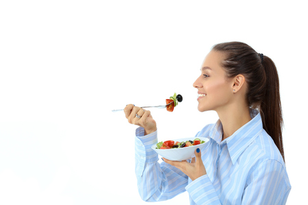 A beautiful girl eating healthy foodの写真素材