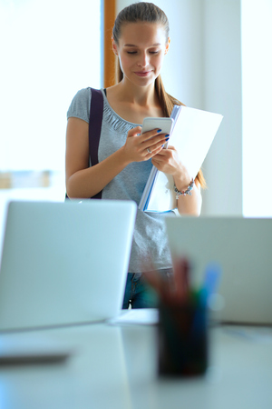 Woman use of mobile phone in universityの写真素材