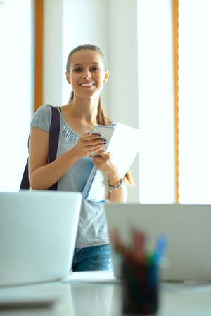 Woman use of mobile phone in universityの写真素材