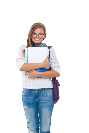 Portrait of young student woman holding exercise books.の写真素材