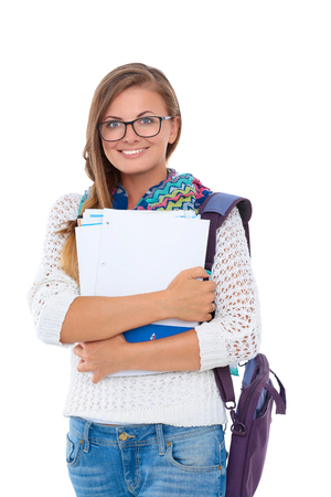 Portrait of young student woman holding exercise books.の写真素材