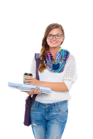 Smiling teenager with laptop on white backgroundの写真素材
