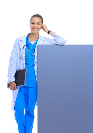 A female doctor with a blank billboard.の写真素材