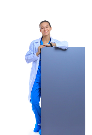 A female doctor with a blank billboard.の写真素材