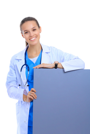 A female doctor with a blank billboard.の写真素材