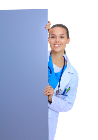 A female doctor with a blank billboard.の写真素材
