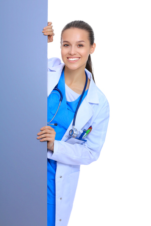 A female doctor with a blank billboard.の写真素材