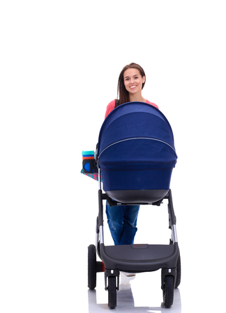 Full length portrait of a mother with a stroller, isolated on white backgroundの写真素材