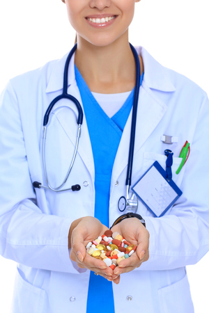 Doctor holding heap of drugs in a handの写真素材