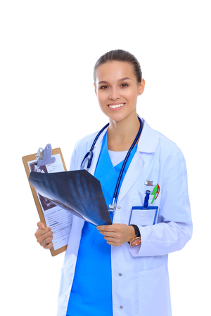 Young female doctor looking at the x-ray picture isolated on white backgroundの写真素材