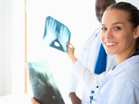 Doctors analyzing an x-ray in a metingの写真素材