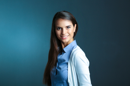 Portrait of a businesswoman , against dark backgroundの写真素材