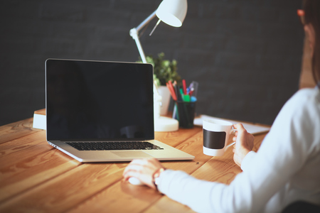 Young female working sitting at a deskの写真素材