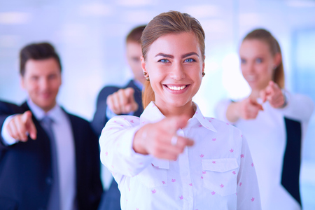 Group of business people pointing to you.の写真素材