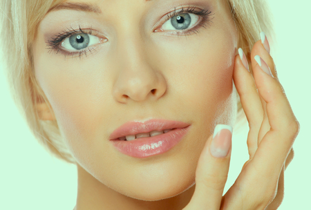 Close up portrait of beautiful young woman face.の写真素材