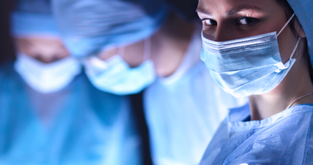 Team surgeon at work in operating room.の写真素材