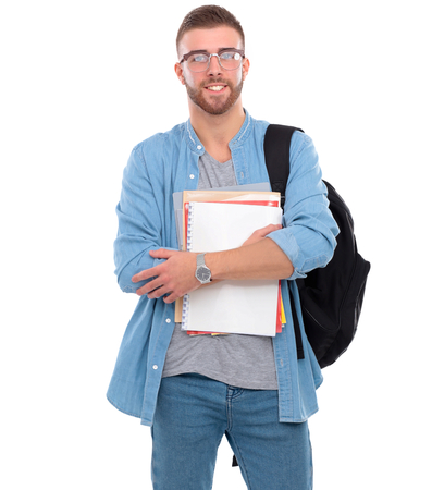 A male student with a school bag holding books isolated on white background.の写真素材