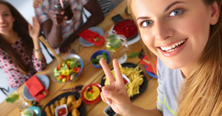 Group of people doing selfie during lunch.の写真素材