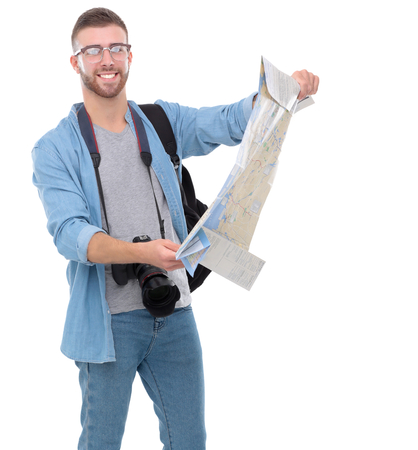 Young man holding map on white backgroundの写真素材