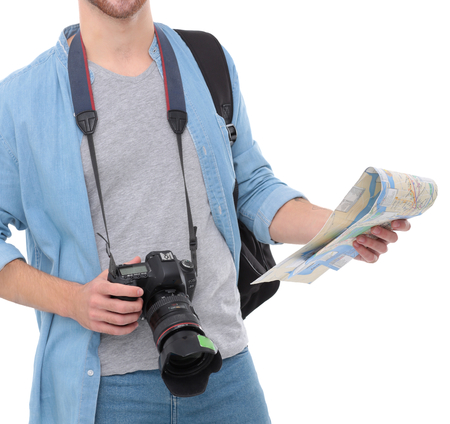 Young man holding map on white backgroundの写真素材