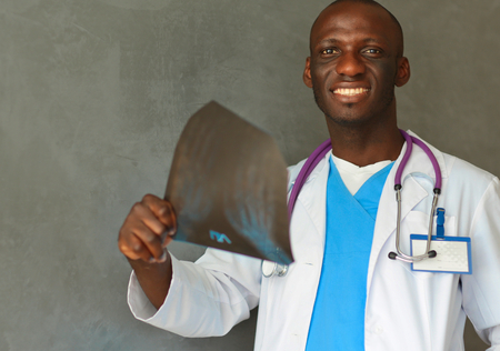 picture of male doctor looking at x-rayの写真素材