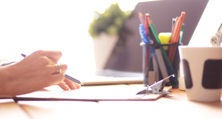 Young female working sitting at a deskの写真素材