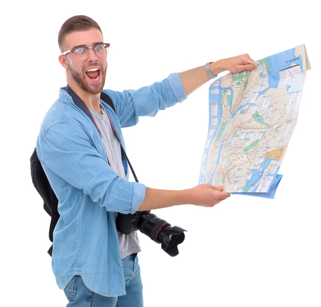 Handsome tourist looking at map isolated on white background.の写真素材