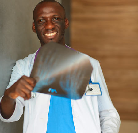 picture of male doctor looking at x-rayの写真素材