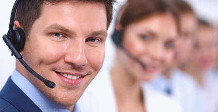 Attractive  positive young businesspeople and colleagues in a call center officeの写真素材