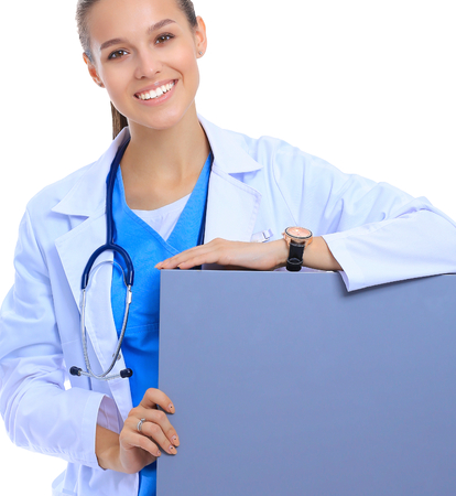 A female doctor with a blank billboard.の写真素材
