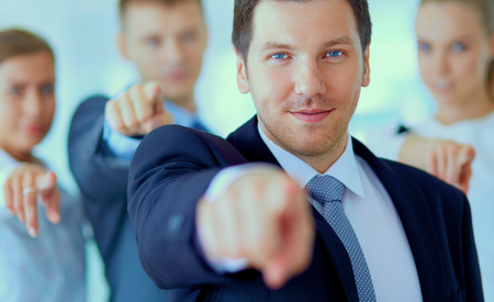 Group of business people pointing to you .の写真素材