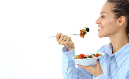 A beautiful girl eating healthy foodの写真素材