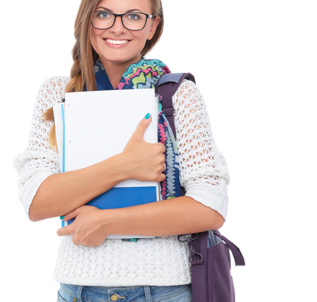 Portrait of young student woman holding exercise books.の写真素材