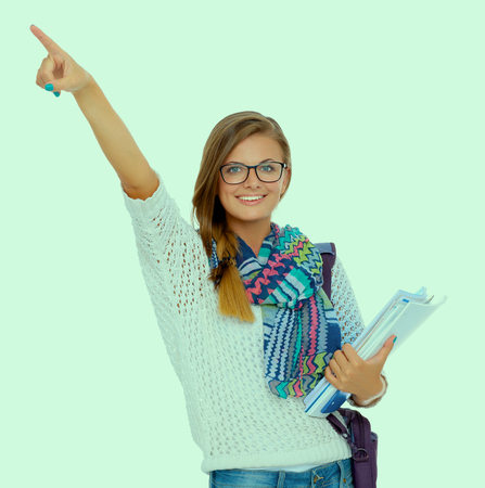 Portrait of young student woman holding exercise books.の写真素材
