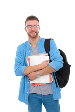 A male student with a school bag holding books isolated on white backgroundの写真素材