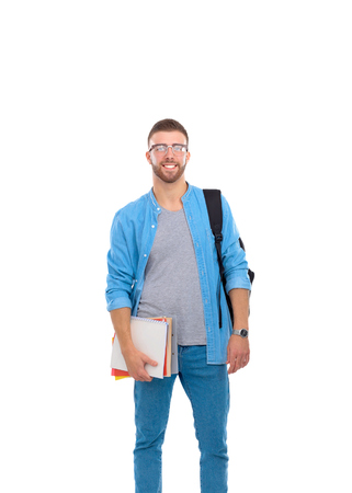 A male student with a school bag holding books isolated on white backgroundの写真素材