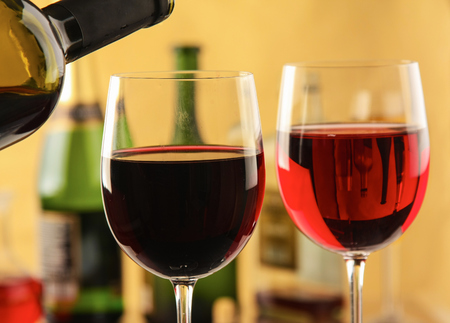 Glass of red wine and the wine bottle.の写真素材