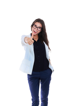 Portrait of a beautiful young woman showing ok, isolated on white background.の写真素材
