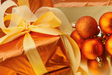 Gift boxes with balls on a christmas background.の写真素材
